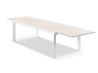 Adele Extension Outdoor Dining Table in White / Travertino.