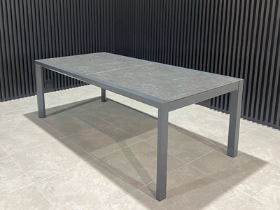 Adele Extension Outdoor Dining Table in Charcoal / Dark Grey - close-up.