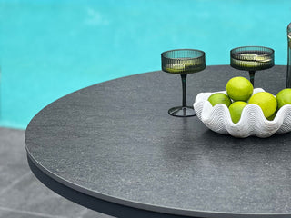 Adele Ceramic Round Outdoor Dining Table in Charcoal / Dark Grey / 100cm - close-up.