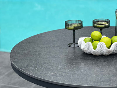 Adele Ceramic Round Outdoor Dining Table in Charcoal / Dark Grey / 100cm - close-up.