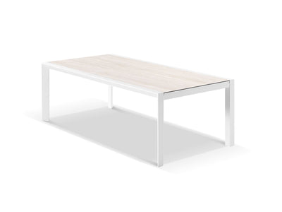 Adele Extension Outdoor Dining Table in White / Travertino - close-up.