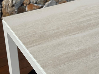 Danli Outdoor Dining Table in White / Travertine / 280x100cm - close-up.