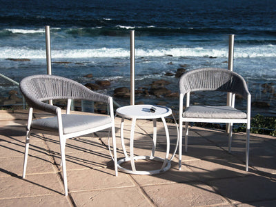 Nivala Outdoor Dining Chair in White / Frost Grey / Grey Ridge side view.