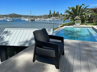 Ubud Outdoor Armchair in Black / Sooty - side view.